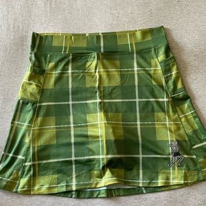 Green plaid athletic running skirt with built-in biker shorts and side pockets